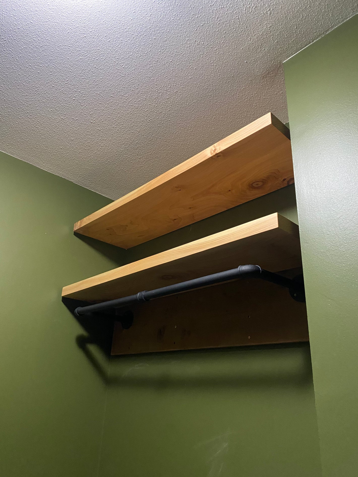 Affordable straight edge cedar shelves with floating brackets by Tundra Designs. 