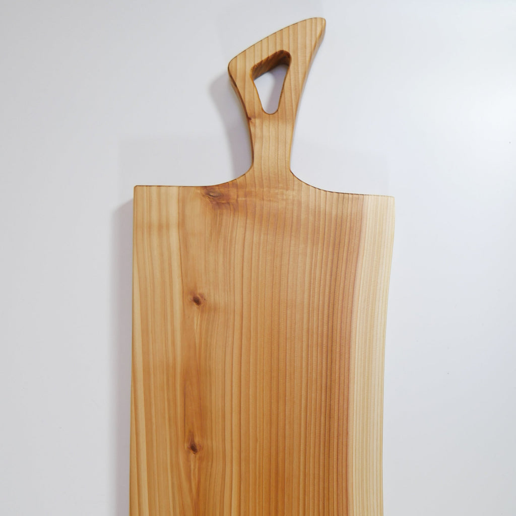 Live Edge Cedar charcuterie board by Tundra Designs, a small business based in Vancouver, Canada